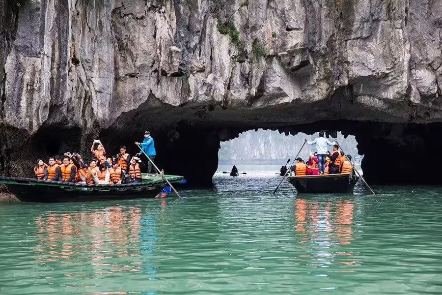 Sitting on bamboo boat to explore Luon Cave
