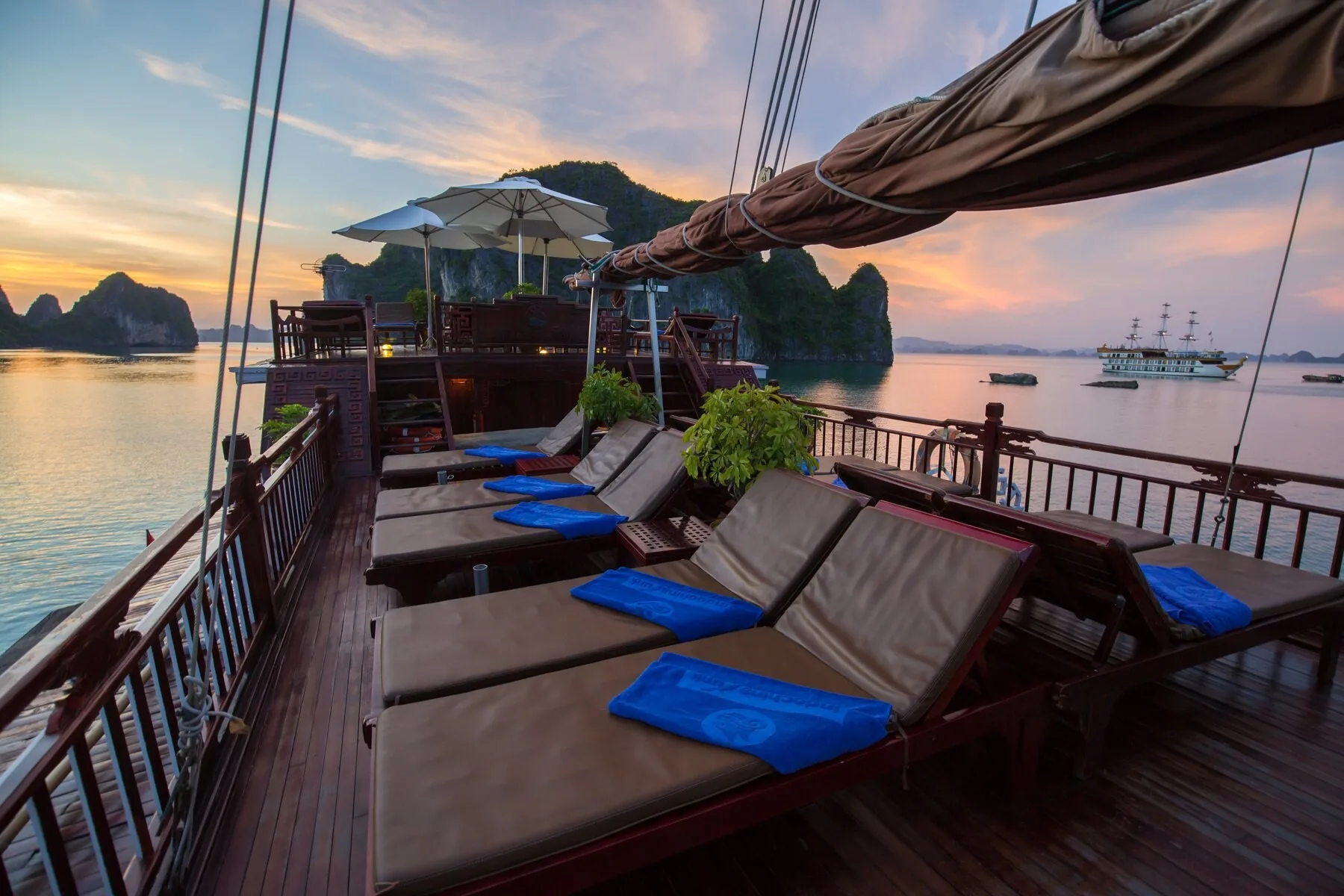 Sundeck and loungers aboard Dragon’s Pearl Junk at sunset